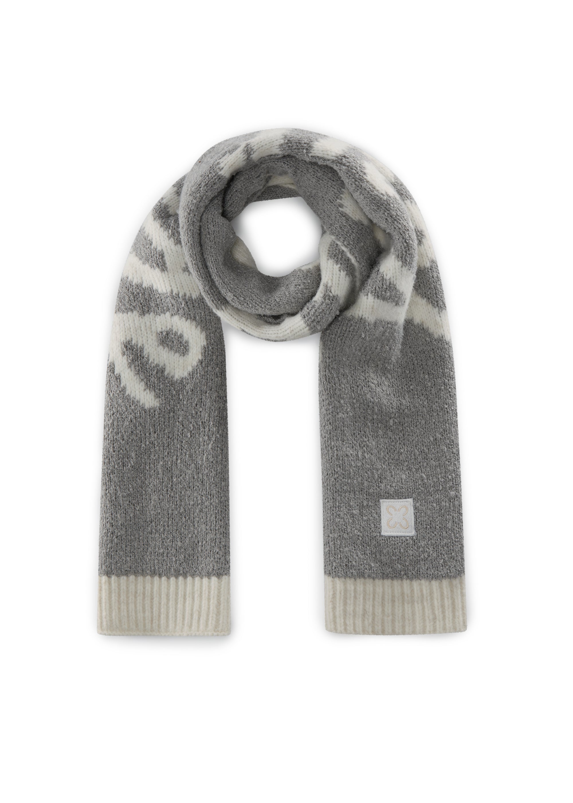 Schmaler Schal aus Bouclé- und Glattstrick mit Statement